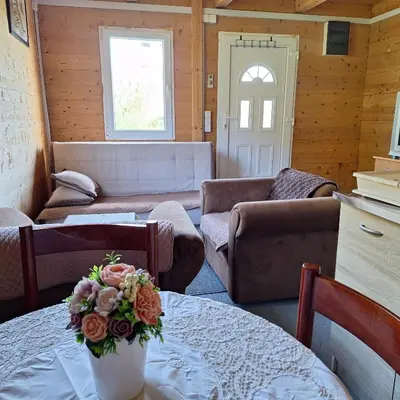 a living room with a couch and a table at Cottage Kolomza in Ulcinj