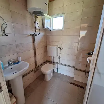 a bathroom with a toilet and a sink at Cottage Kolomza in Ulcinj