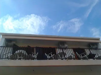 a balcony with graffiti on the side of a building at Apartment Olimp Ulcinj in Ulcinj