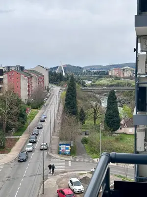 a street with cars parked on the side of a road at Diamond apartment in Podgorica