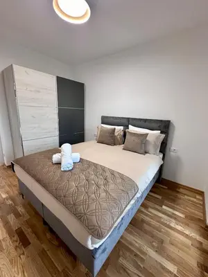 a bedroom with a large bed in a room at Diamond apartment in Podgorica