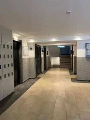 an empty hallway in a building with a staircase at Luxury apartment with garage in Old bakery in Budva