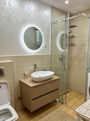 a bathroom with a sink and a shower at Luxury apartment with garage in Old bakery in Budva