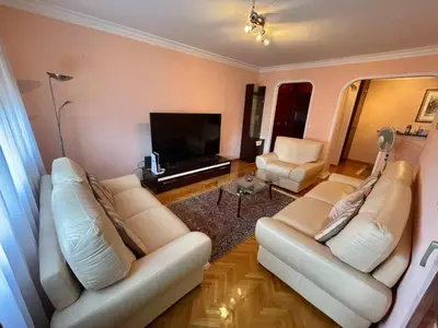 a living room with two white couches and a television at Apartman Darija in Bar