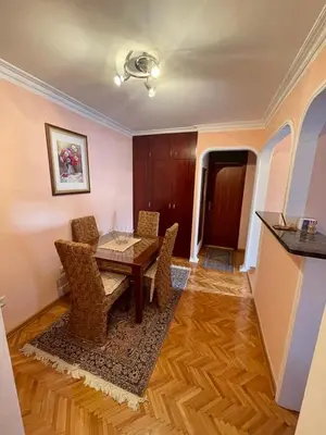 a dining room with a table and chairs at Apartman Darija in Bar