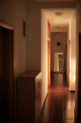 a hallway of a kitchen with a counter and a refrigerator at Mountain View Villa in Budva