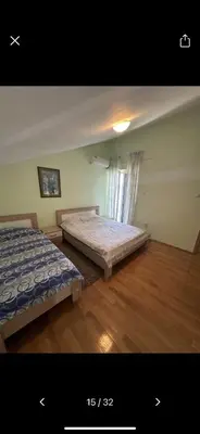 a bedroom with two beds and a window at Njaro Del Mar 18 in Petrovac na Moru