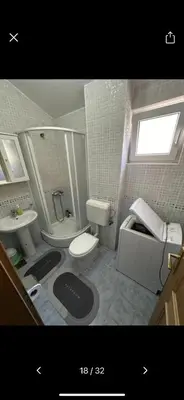 a bathroom with a toilet and a sink at Njaro Del Mar 18 in Petrovac na Moru
