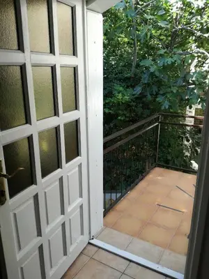 an open door leading to a balcony with a patio at Guest House Vila Bak in Budva