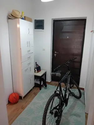 a bike parked in a room with a door at Piano Seaside in Ulcinj
