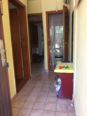 a hallway with a bathroom with a sink and a toilet at Zagradge I.N. apartments in Sutomore