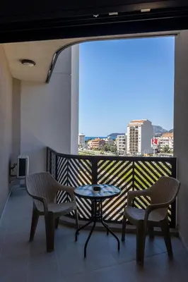 a balcony with a table and two chairs and a view at Sea Breeze apartment in Bar