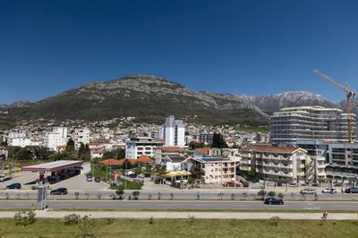 a view of a city with a mountain in the background at Sea Breeze apartment in Bar