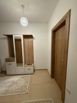 a room with a hallway with a door and a mirror at Stan 60m2 in Bar