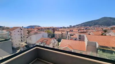 a view of a city from the roof of a building at Tehnoplus apartment in Budva