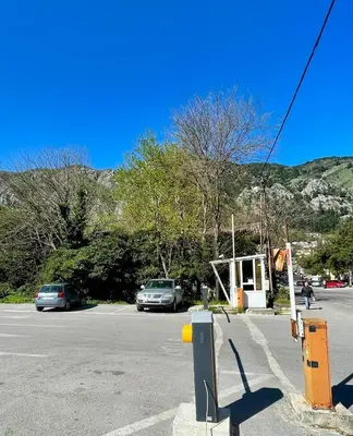 a parking lot with cars parked on the side of a road at Apartment Studio Z&M in Kotor