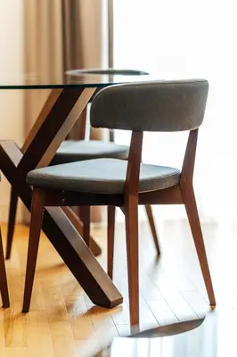 a chair sitting at a glass table at Luna skyline sea view apt in Budva