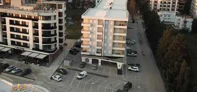 an aerial view of a parking lot next to a building at Bulevar Apartments in Ulcinj