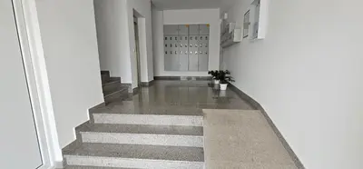 a hallway with stairs in a building at Bulevar Apartments in Ulcinj