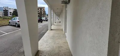 an empty hallway of a building next to a street at Bulevar Apartments in Ulcinj
