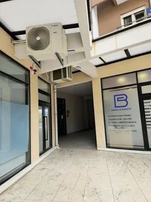 an empty building with a projector on the ceiling at Central Point apartment in Podgorica