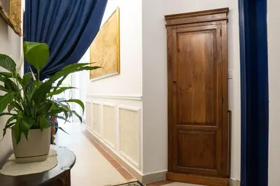 a hallway with a door and a potted plant at Glanz Antique Paradise near the Sea in Kotor