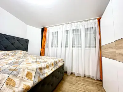 a bedroom with a bed and a window at Three bedroom apartment Budva in Budva