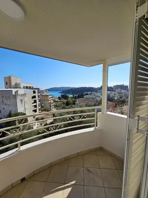 a balcony with a view of the ocean at Tirke Apartment in Becici