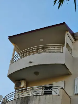 a balcony on the side of a building at Tirke Apartment in Becici