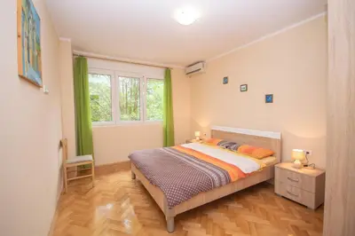 a bedroom with a bed and a window at Apartment Nikolic Kotor in Kotor