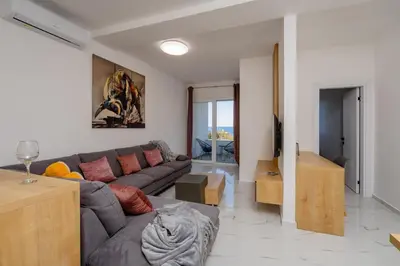 a living room with a couch and a table at Aurora Apartments in Bar