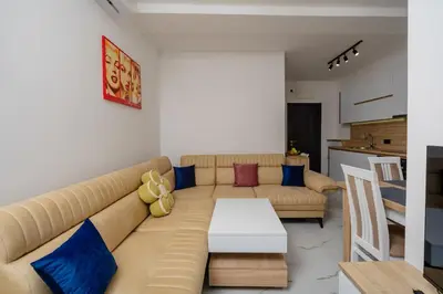 a living room with a couch and a table at Aurora Apartments in Bar