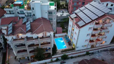 an aerial view of a building with a swimming pool at Villa Iper in Budva