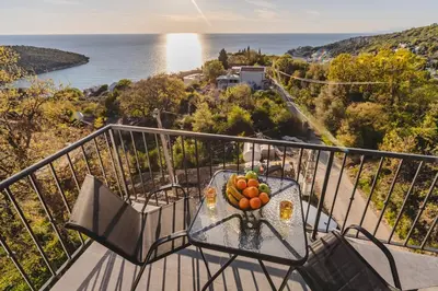 a bowl of fruit on a table on a balcony at B&O Seaview in Bar