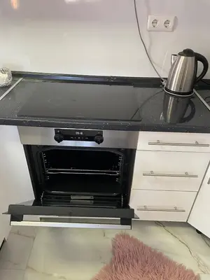 a kitchen with an oven with a pot on the stove at Apartment with large living room in Bar