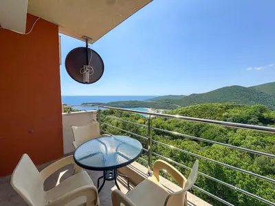 a balcony with a table and chairs and a view at One-bedroom Apart, with panoramic view, Prijevor in Prijevor