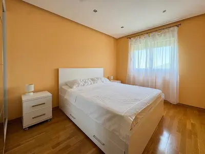 a bedroom with a white bed and a window at One-bedroom Apart, with panoramic view, Prijevor in Prijevor