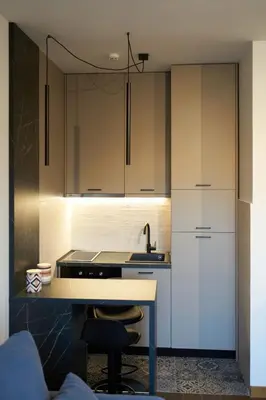 a kitchen with white cabinets and a sink at Montenegro Luxury Studio - Hill Homes in Podgorica