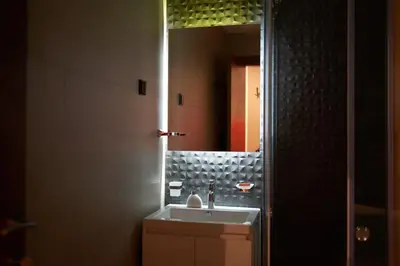 a bathroom with a sink and a mirror at Montenegro Luxury Studio - Hill Homes in Podgorica