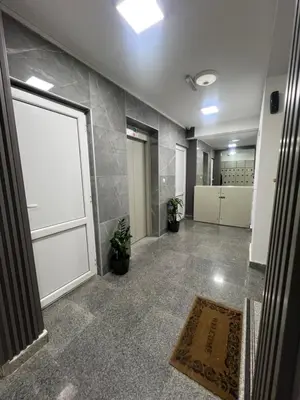 a large room with a large door and a rug at Apartman Marina in Podgorica