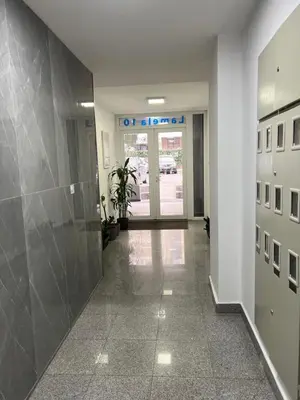 a hallway of a office with a sign on the wall at Apartman Marina in Podgorica