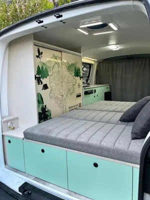a bed in the back of a van at Eagle's path campers Montenegro in Podgorica
