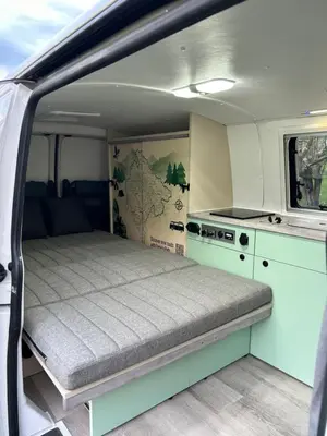a bed in the back of a camper van at Eagle's path campers Montenegro in Podgorica