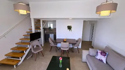 a living room with a couch and a table at Apartments Danica in Petrovac na Moru
