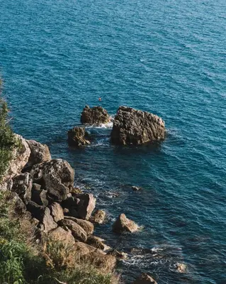 a group of rocks in a body of water at La Mer Beach Residence in Ulcinj