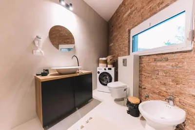 a bathroom with a sink and a toilet at La Mer Beach Residence in Ulcinj
