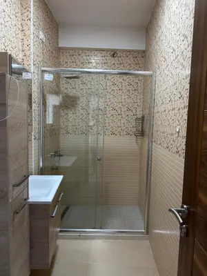 a bathroom with a shower and a sink at La Mer Beach Residence in Ulcinj