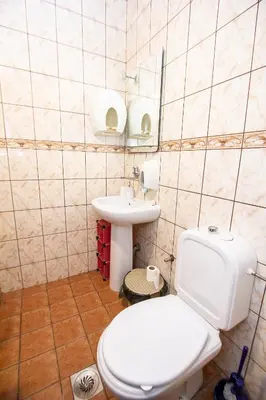 a bathroom with a white toilet and a sink at Studio Mimi City Center Bar in Bar