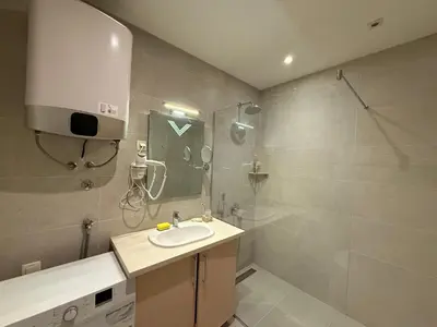 a bathroom with a sink and a shower at Apartment WOW Budva - With free parking in Budva