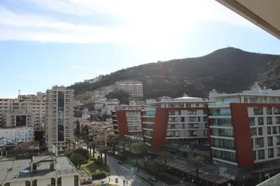 a view of a city with buildings and a mountain at WoW APARTMENT'S 604-607 in Budva